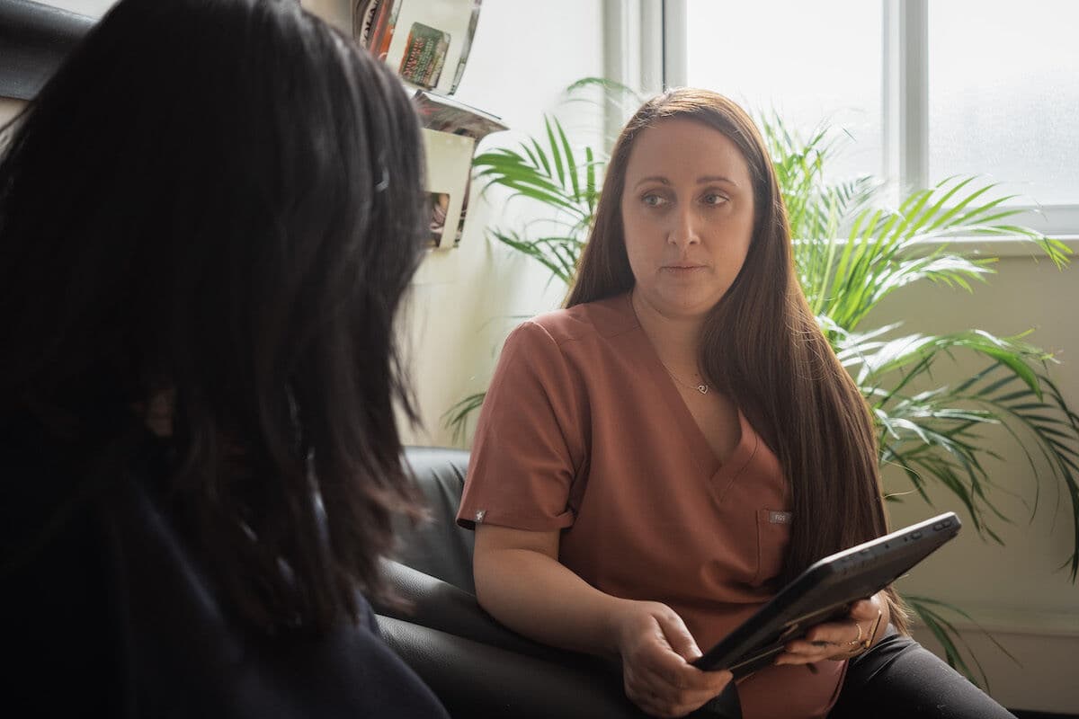 Clinician talking through a root canal treatment plan with a patient
