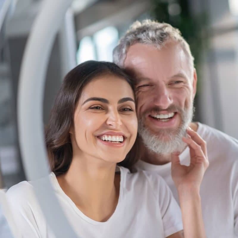 Couple smiling after Same Day Teeth dental implant treatment