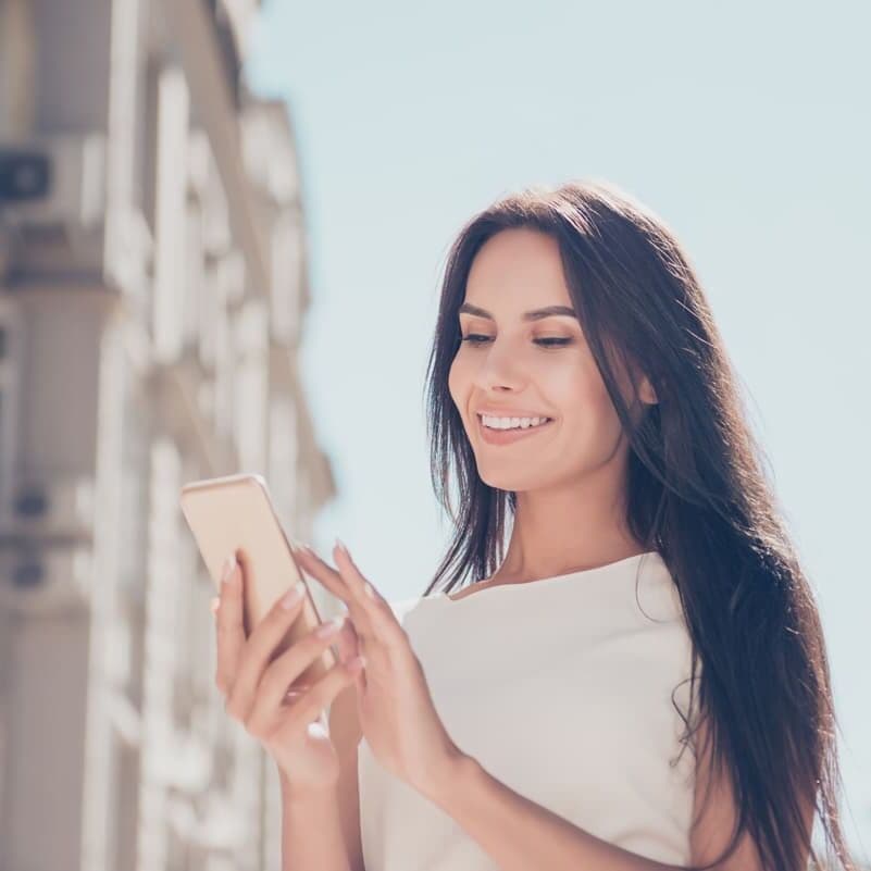 Smiling woman after a full smile makeover