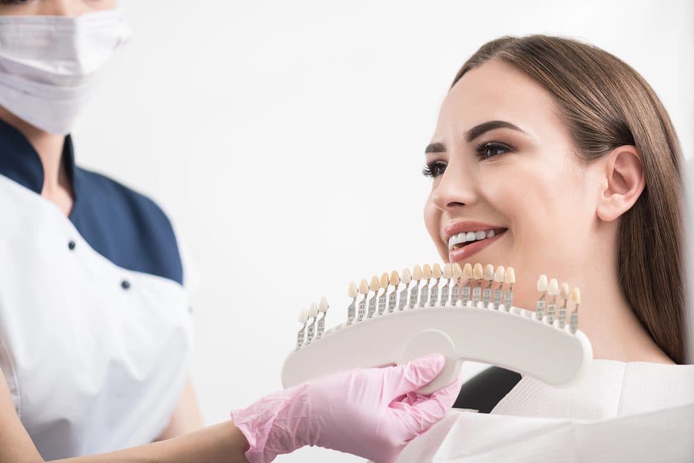How are crowns attached to implants